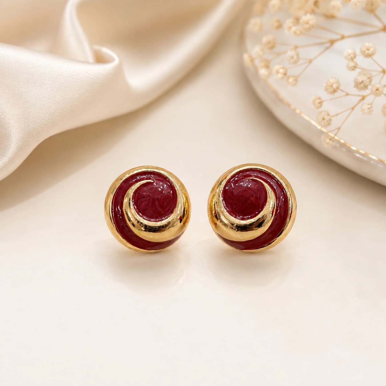 Celeste Burgundy Gold Spiral Stud Earrings by Soni De Nakhre